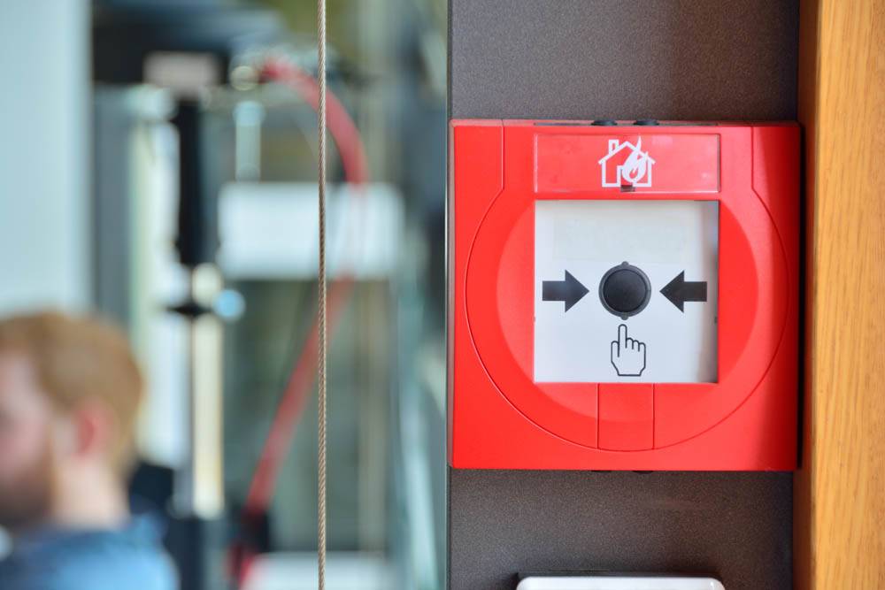 break glass fire alarm on wall in office